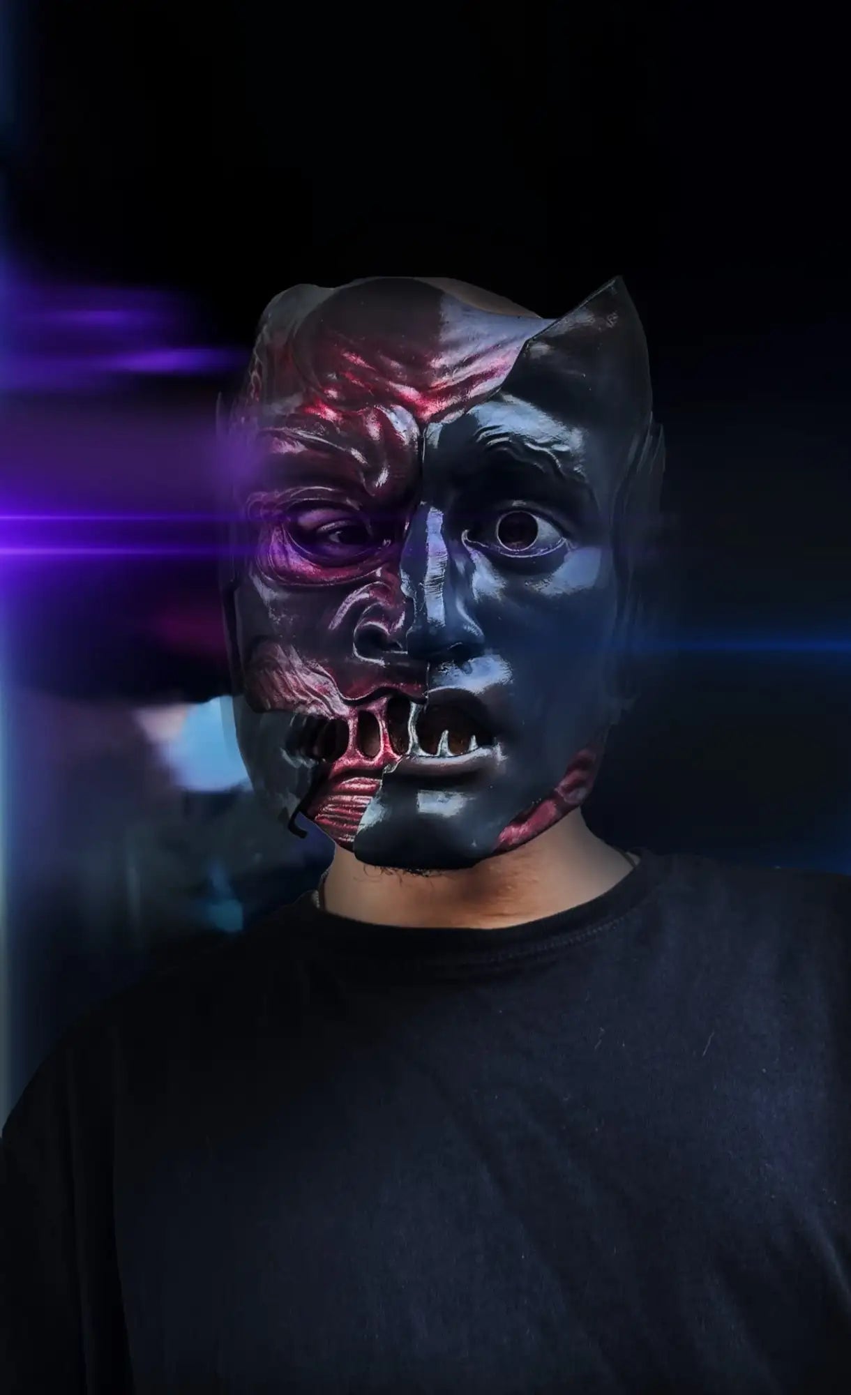 Black and red dual-faced mask with cat ears, likely made of plastic or latex.