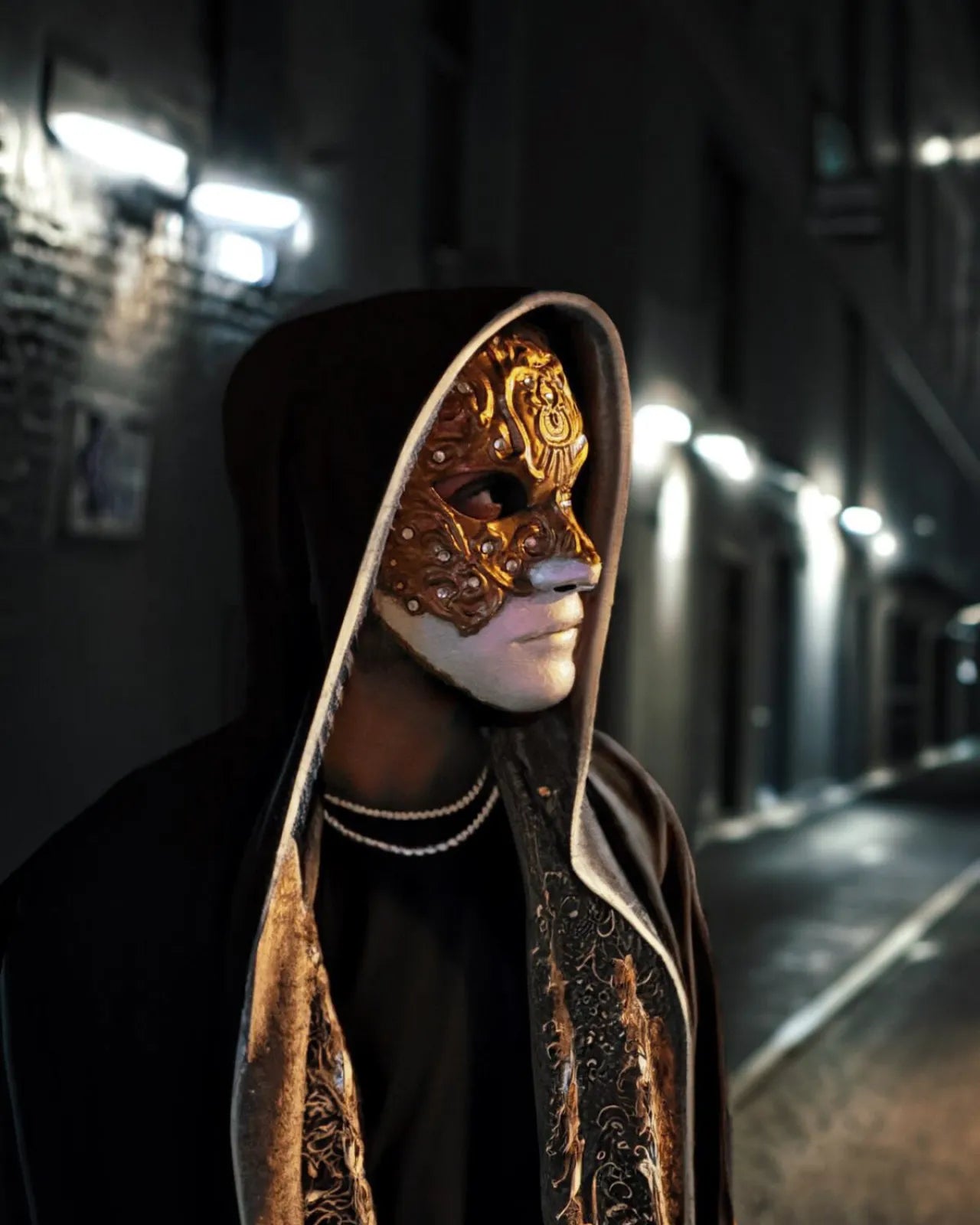 Man wearing handcrafted Venetian mask, Eyes Wide Shut Mask Original Pattern - Detailed Bill Harford Design Mask, in dark alley.