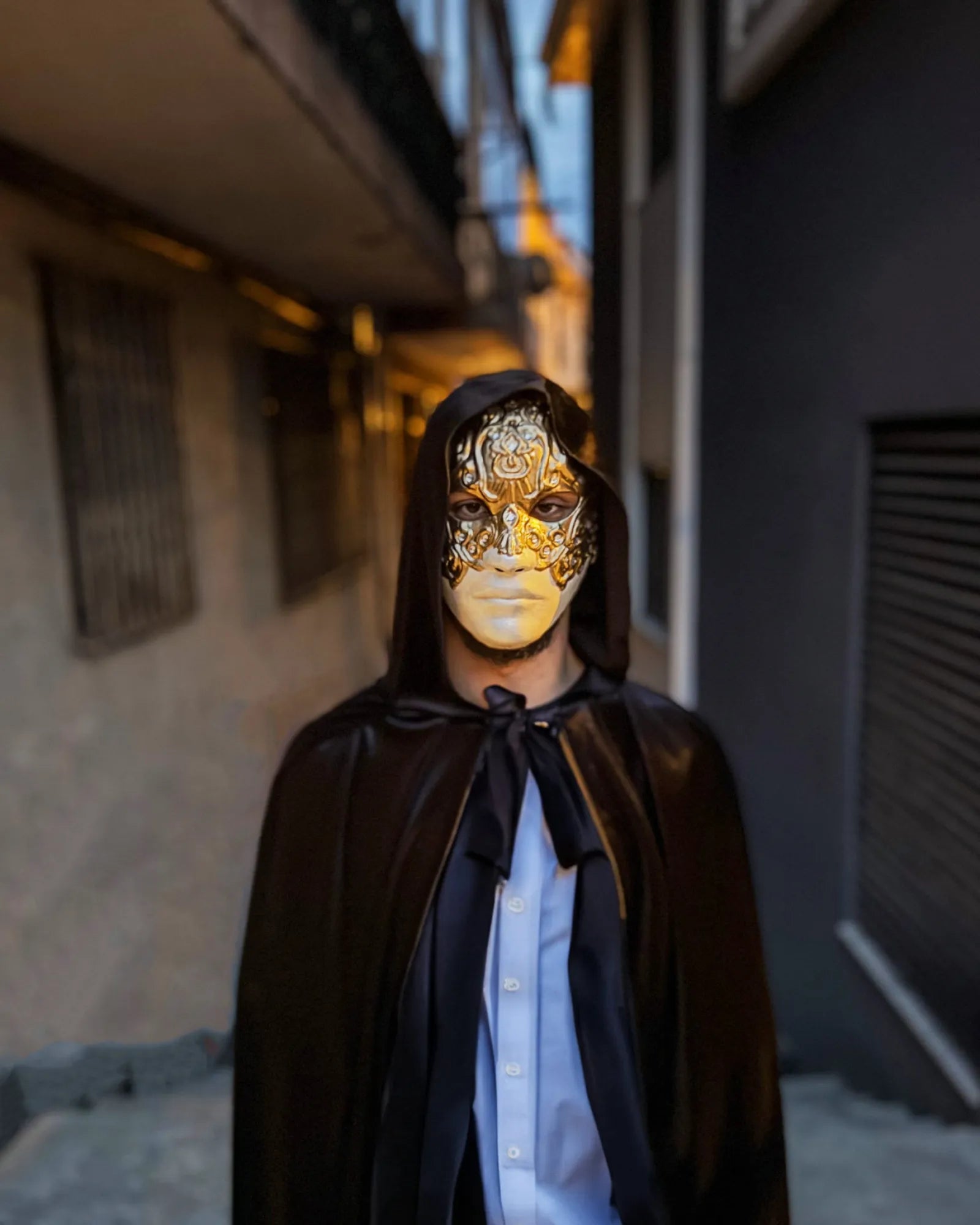 Person wearing Eyes Wide Shut Mask Original Pattern - Detailed Bill Harford Design Mask, handcrafted Venetian cosplay accessory.