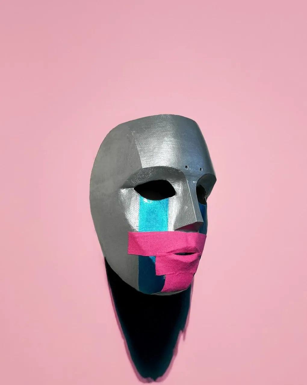 Hollywood Undead Deuce; 2010, Metal Look, Pink Tape, Tha Produca Big Deuce mask, handcrafted Venetian cosplay fantasy mask on pink background