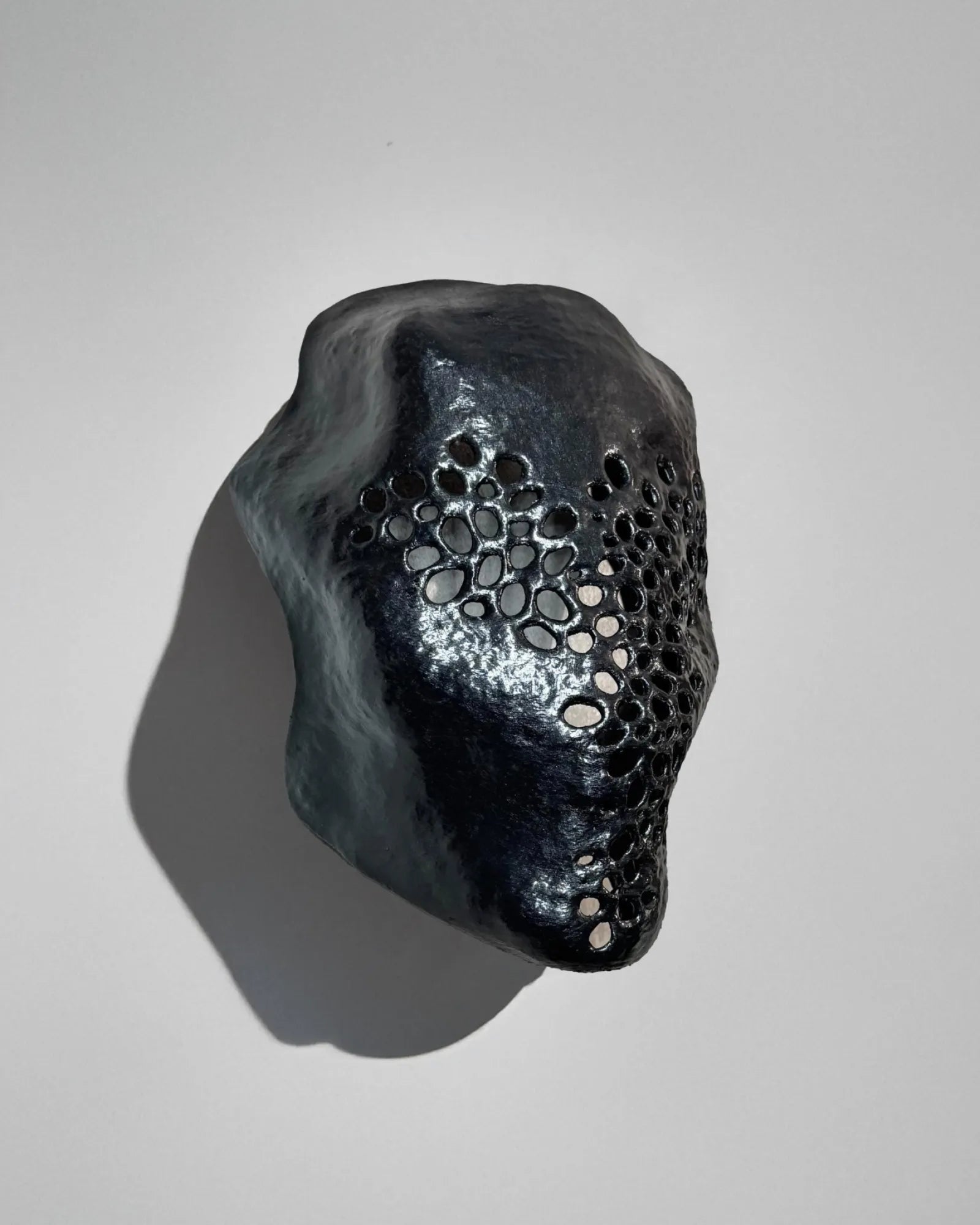 Symbiotic Trypophobia Venom; Alien Perforated Black Mask - handcrafted Venetian mask for cosplay and fantasy.