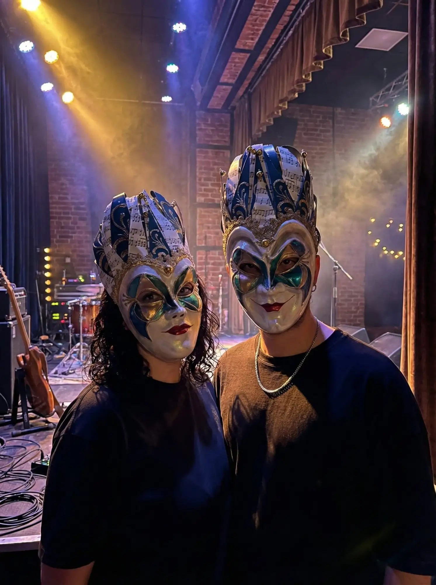 Venetian mask with intricate patterns and metallic accents.