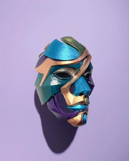 Abstract Colorful Puzzle; Handcrafted Colorful Geometric Face Art mask displayed against a purple background.