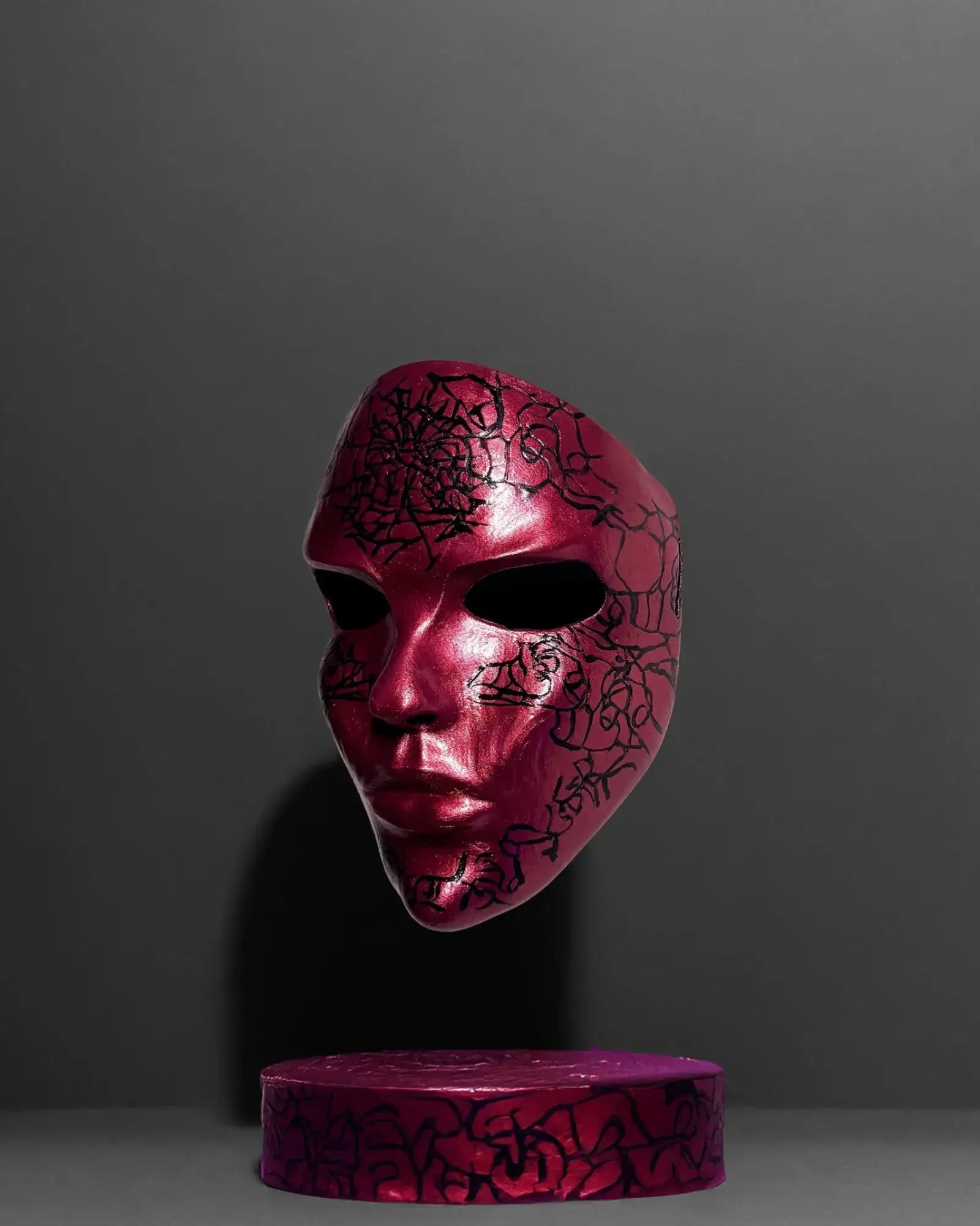 Abstract Crackle look black pattern; Handmade Red Masquerade Mask crafted for Venetian cosplay and fantasy events, handcrafted design.