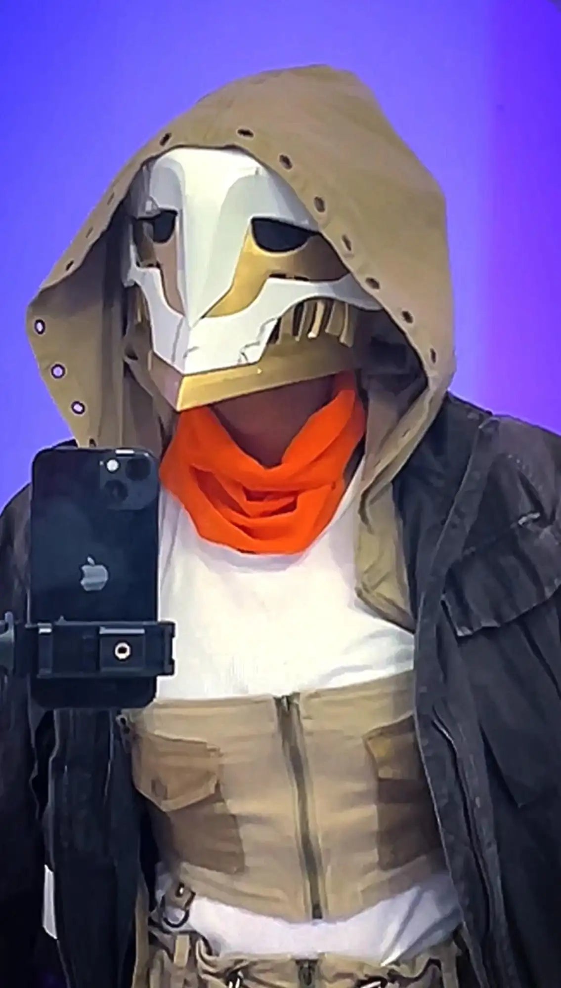 Duck mask with orange scarf and black jacket