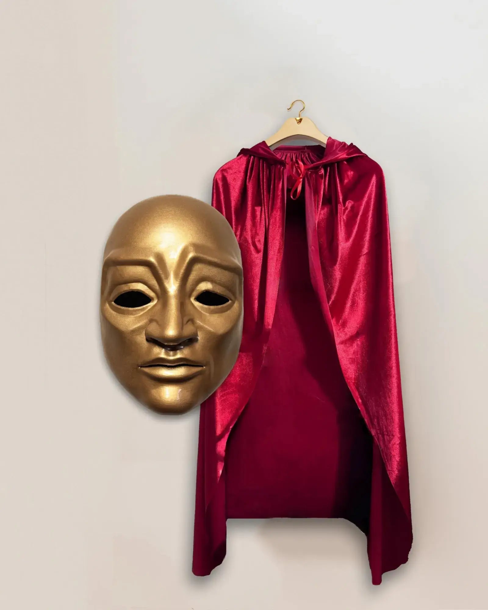 Eyes Wide Shut Golden Red Cloak Mask and Velvet Cloak, Red Cloak Judge Mask displayed with a golden Venetian mask and red velvet cloak.