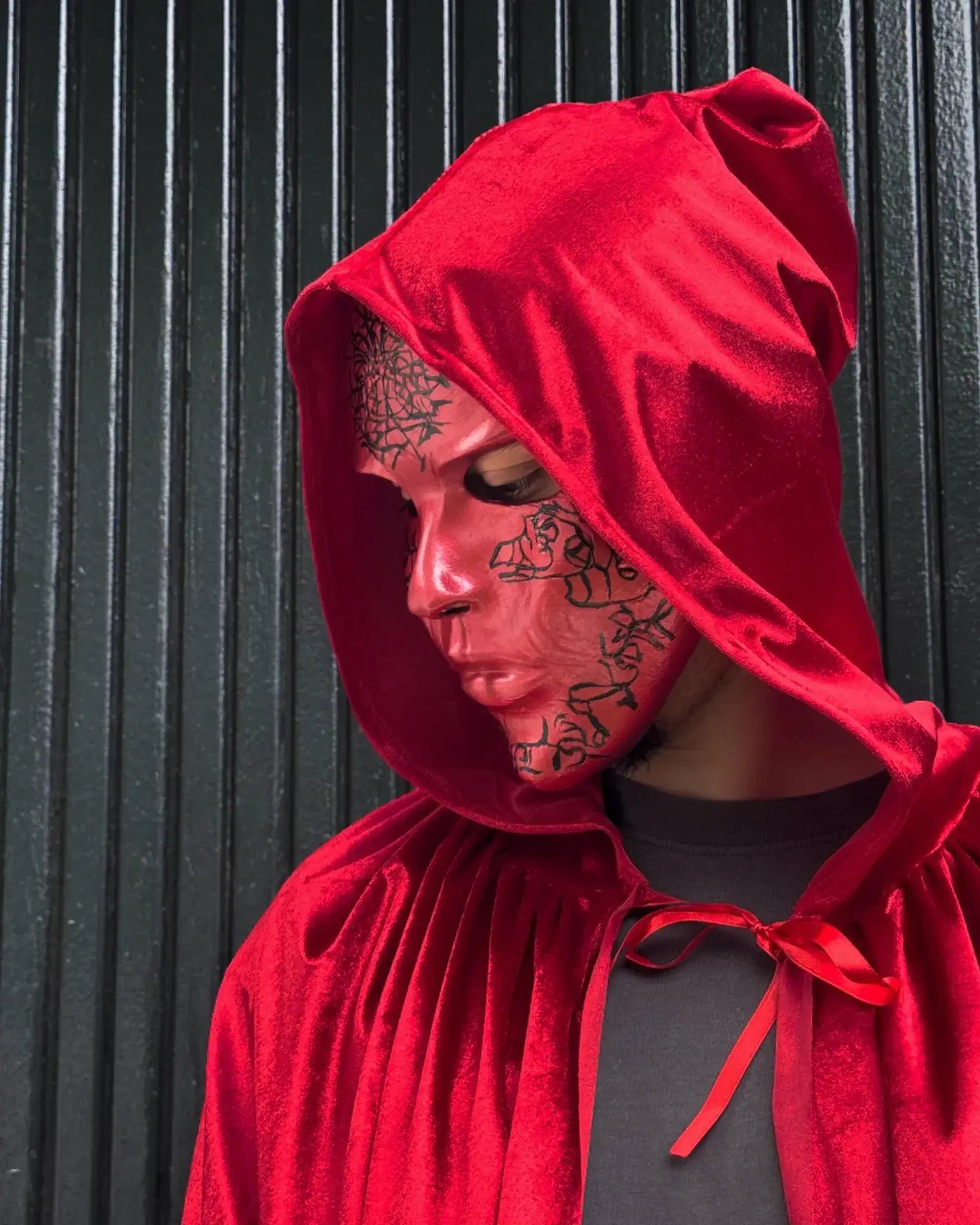 Eyes Wide Shut Red Velvet Hooded Cloak; Inspired Cape Cloak worn by model with striking makeup for a fantasy costume.