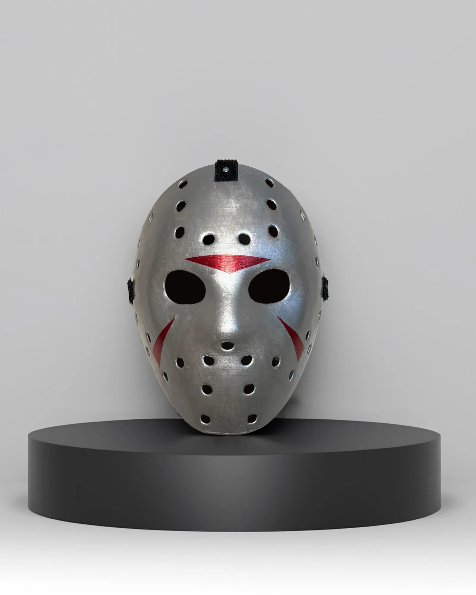 Jason Voorhees Friday the 13th; Handcrafted Spooky Halloween Mask on display, featuring Venetian style, ideal for cosplay and masquerades.