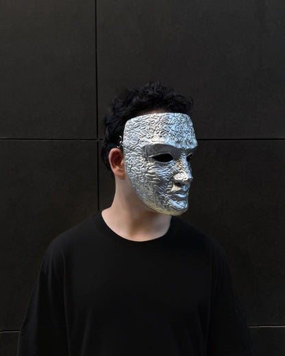 Man wearing King Baldwin IV Kingdom of Heaven "The Leper" Embroidered Ancient Mask, handcrafted Venetian cosplay mask, silver design.