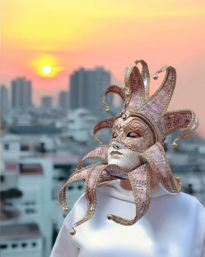 Musical Jester; Gold Full Face with Pink Music Motifs Venetian Sun mask, handcrafted cosplay mask in sunset cityscape.