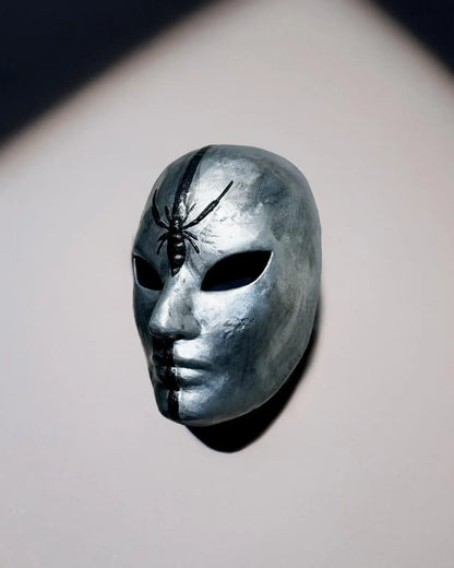 Silver Spider Mask with Black Stripe & Spider; Unique Cosplay Prop mask on a grey background. Handcrafted venetian design.