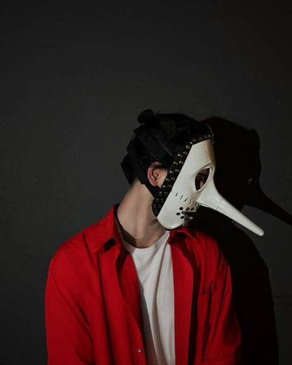 Person wearing Slipknot Chris Fehn; White and Black, Strange Liar Mask, handcrafted Venetian mask for cosplay and fantasy events.