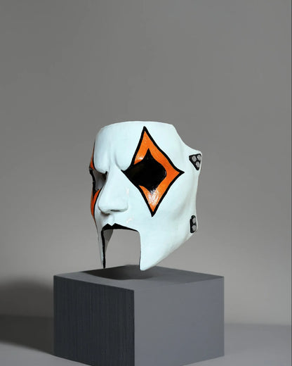 Slipknot Jim James Root; New Design, Orange and Black Detail Metal Music mask, handcrafted Venetian cosplay fantasy mask displayed on stand.
